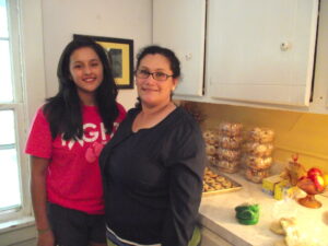 Dolores (joined on the left by her daughter Frieda) is proud to work with her family, who helps out with her baking.